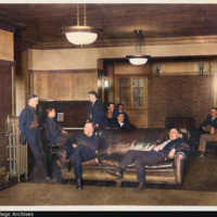 COLORIZED: Men's Dormitory / West Hall interior: lobby, with eleven men