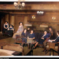 COLORIZED: New Women's Dormitory /Nourse Hall interior: parlor, with nine women